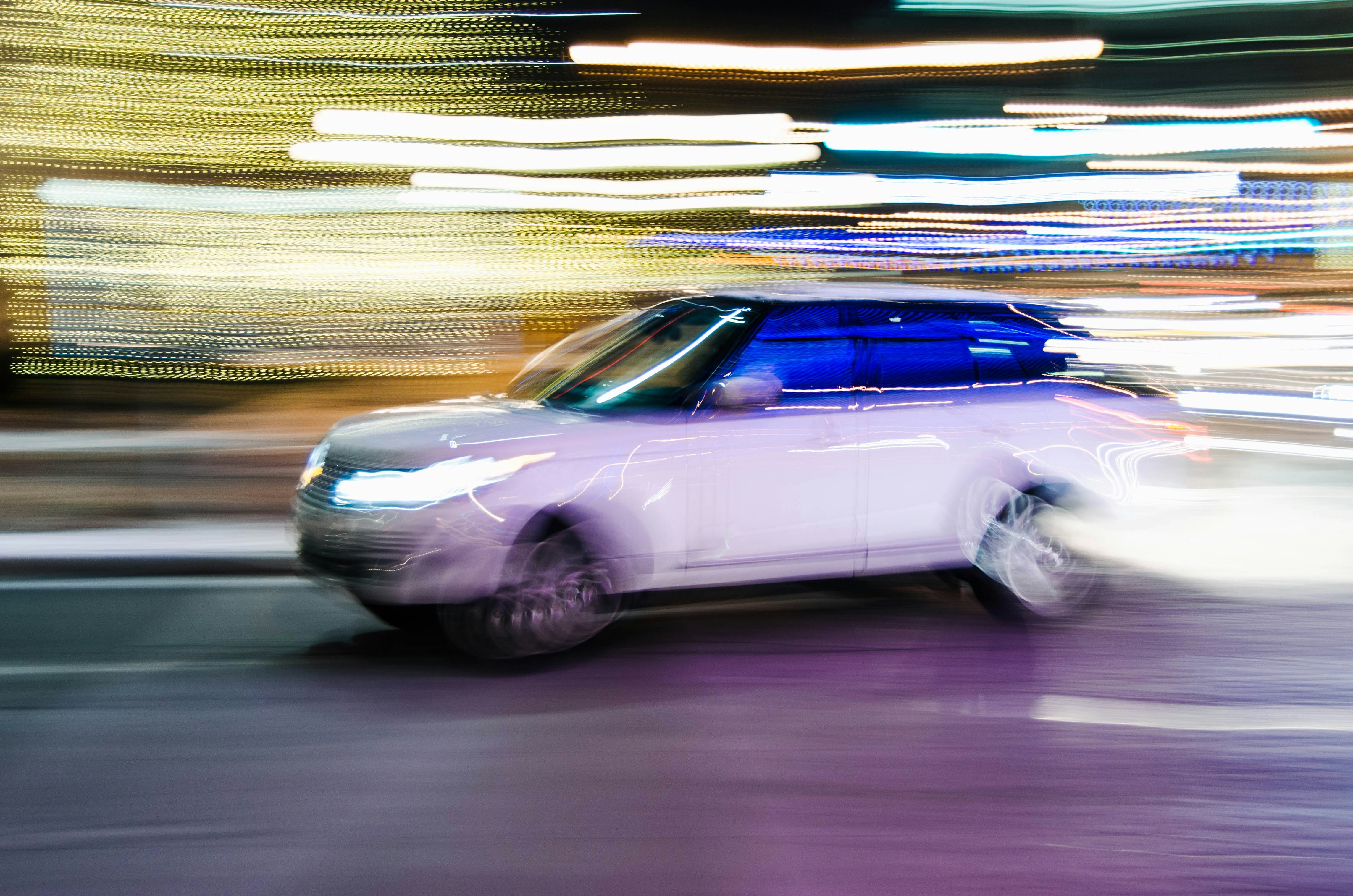 time lapse photography of vehicle on road